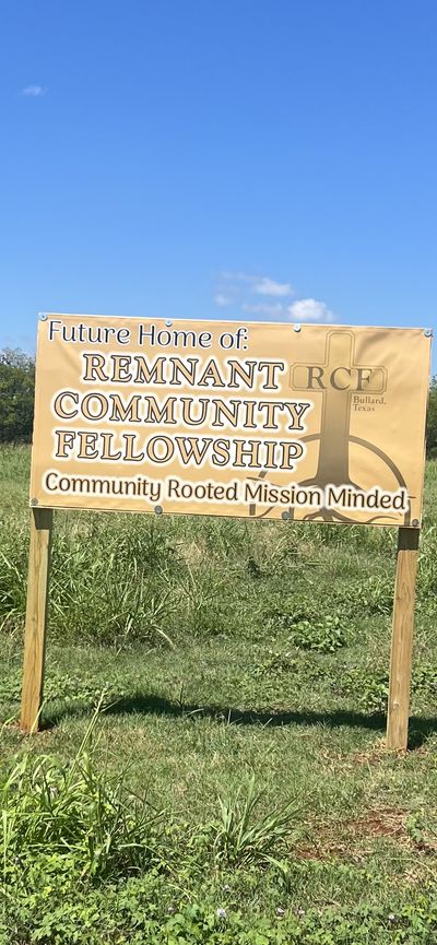The Remnant Community Fellowship banner standing on the newly purchased land in Bullard, Texas.